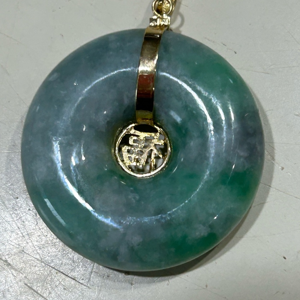 Elegant Green Jade Pendant with 14 karat Gold Accent
